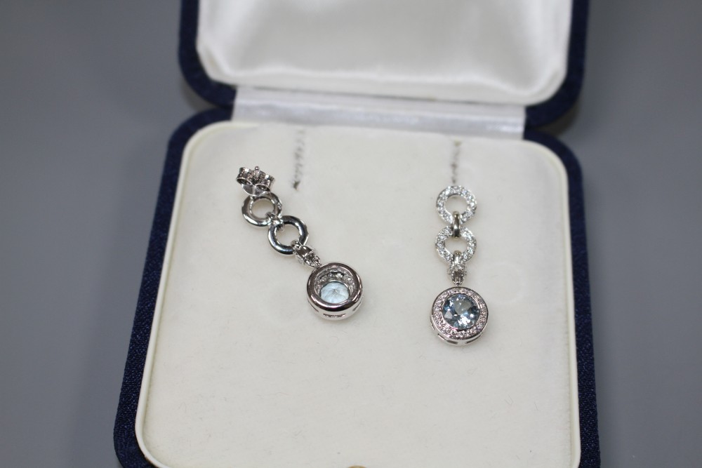 A modern pair of 18ct white gold, aquamarine and diamond set drop earrings, drop 29mm, gross weight 7.5 grams.